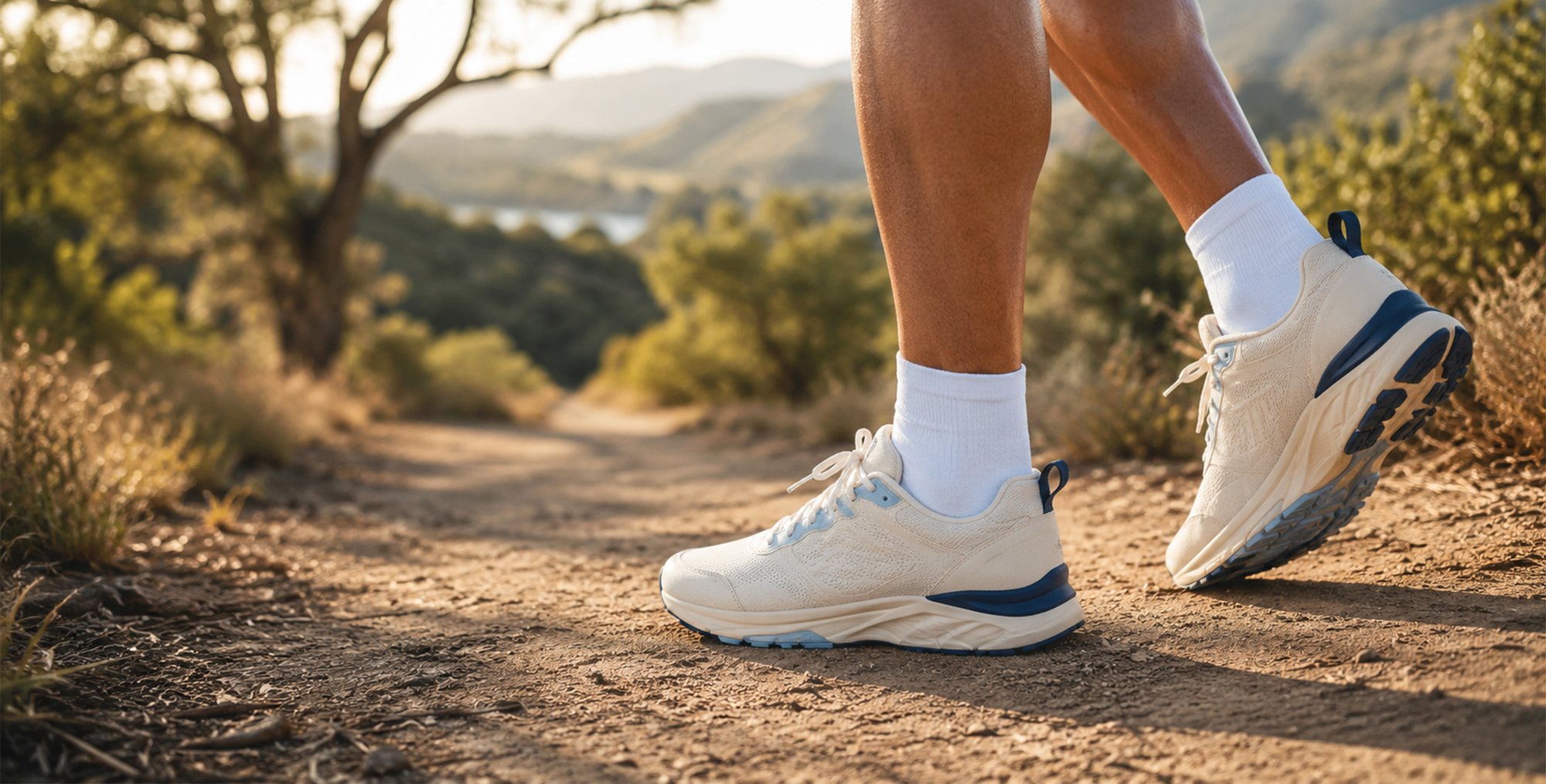 Trail runner's shoes on a sunlit dirt path